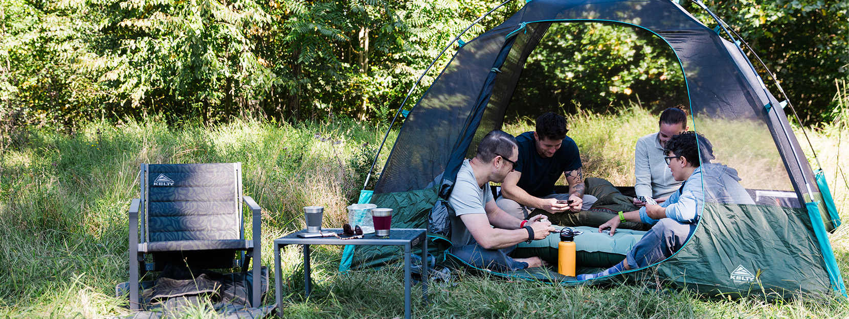 Group of happle people camping in large tent