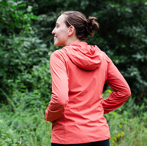 Happy woman wearing jacket outdoors